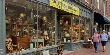 Charming U.S. antique shop exterior with vintage items and 2025 banner