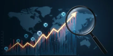 Magnifying glass over a financial chart with glowing gems, symbolizing hidden gem U.S. small-cap investment opportunities.